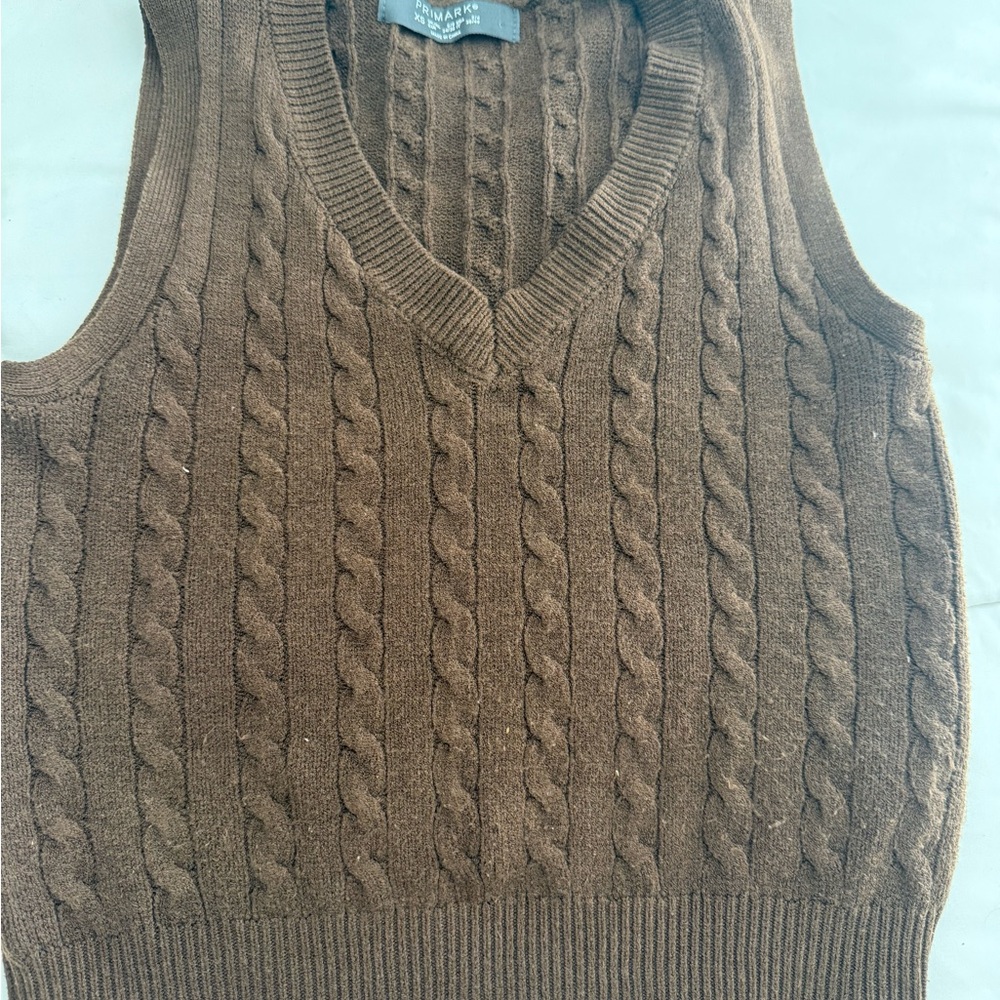 brown sweater vest